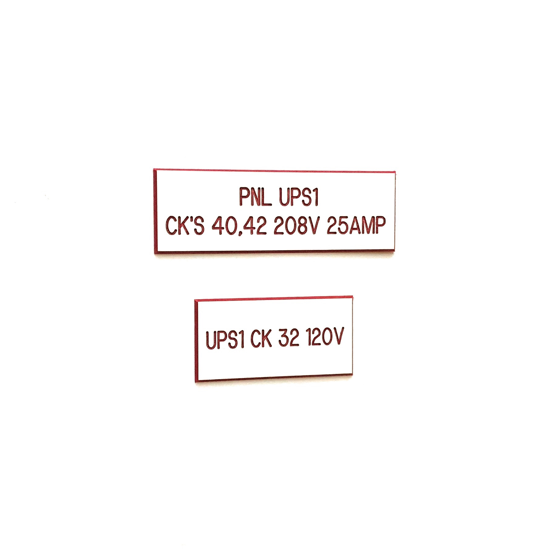 Engraved phenolic UPS panel circuit identification labels in two sizes, red on white
