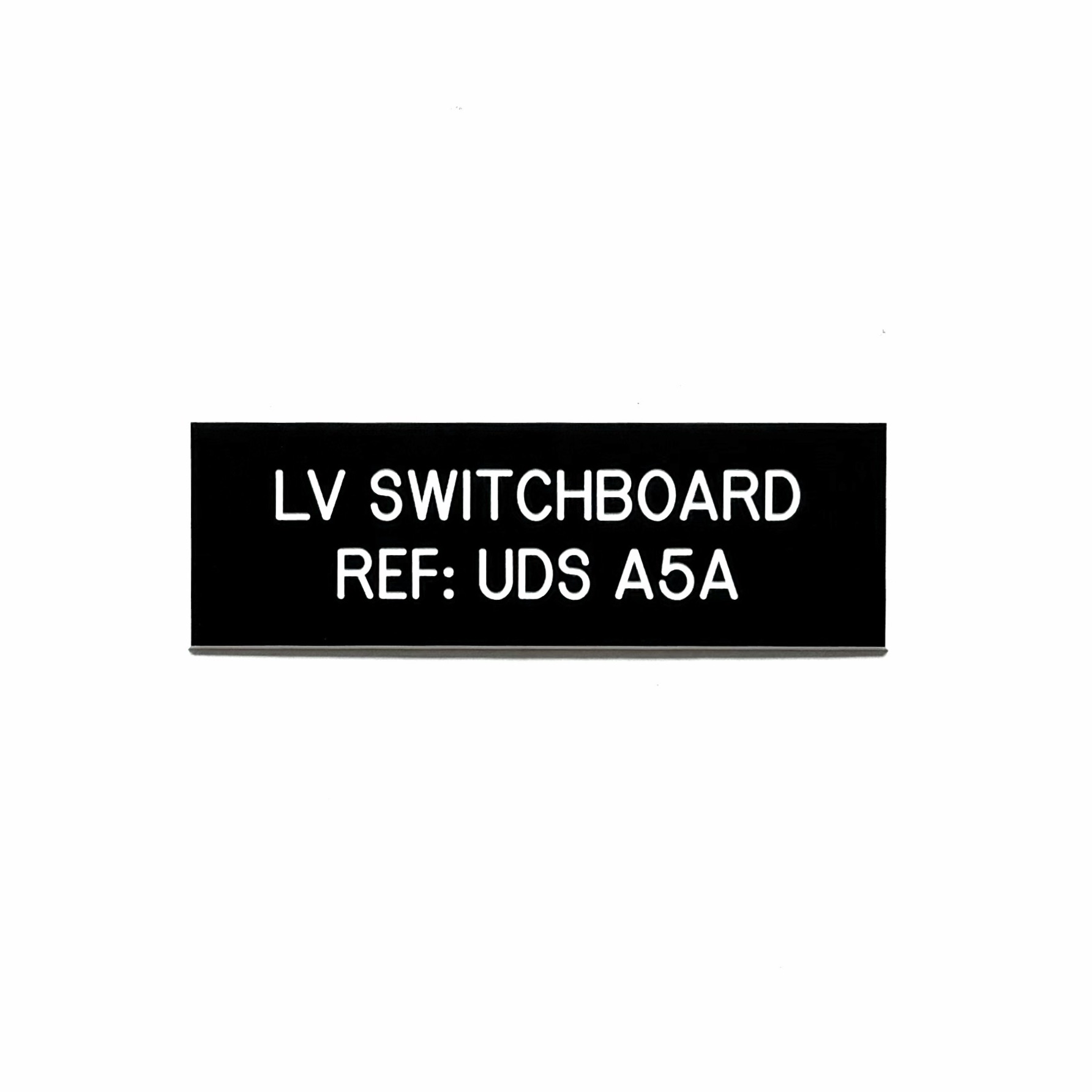 Engraved phenolic low voltage switchboard identification label for data center electrical equipment, white on black