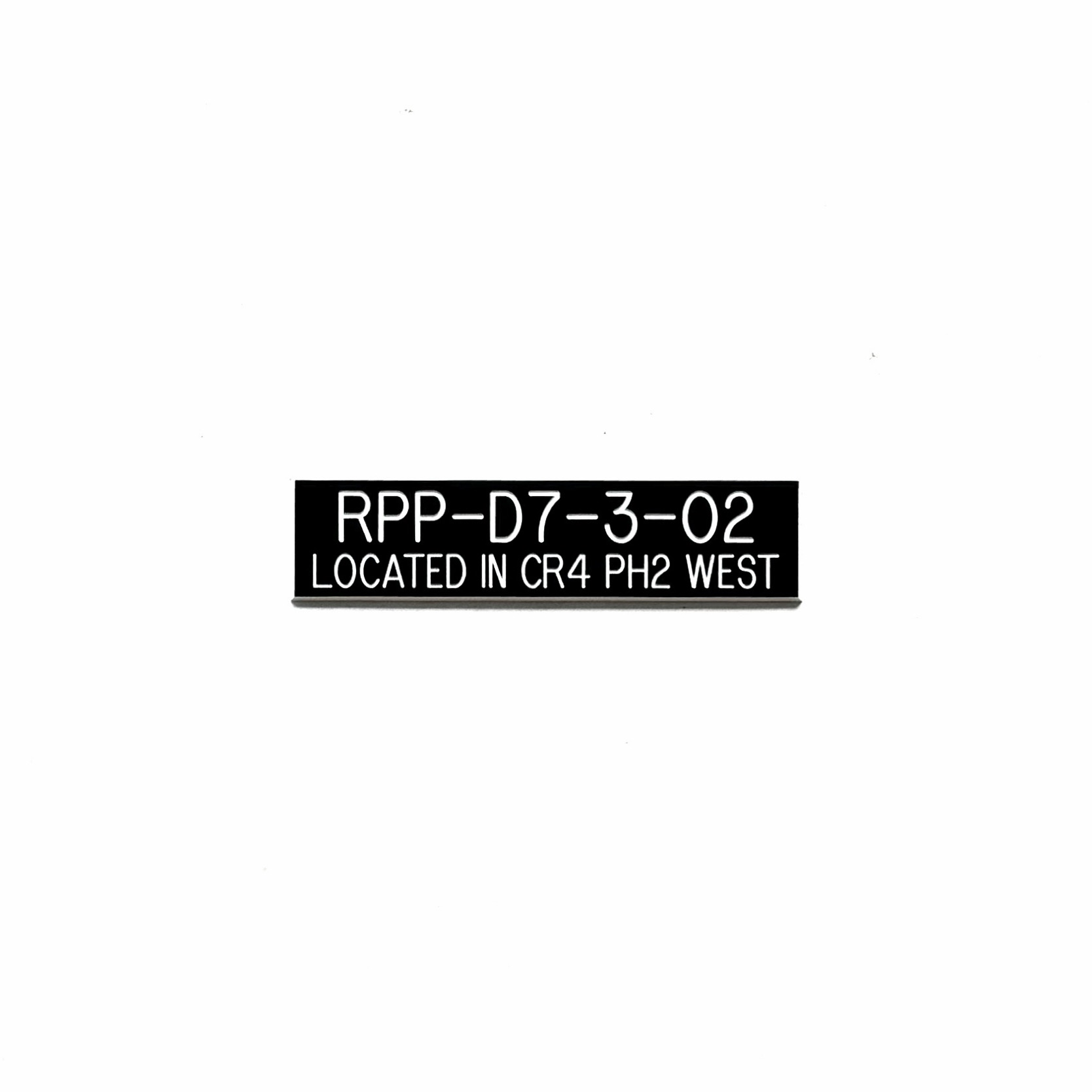 Engraved phenolic remote power panel identification label with computer room location, white on black